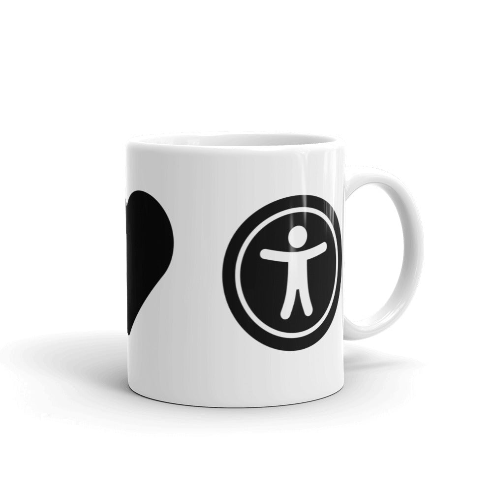 Black universal design logo on right side of white coffee mug.