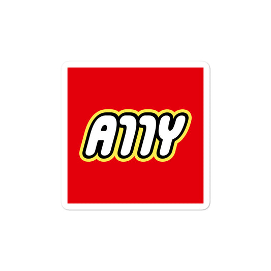 Rounded white A11Y letters surrounded by a black border, surrounded by a yellow border, center aligned on red 3 inch square sticker.