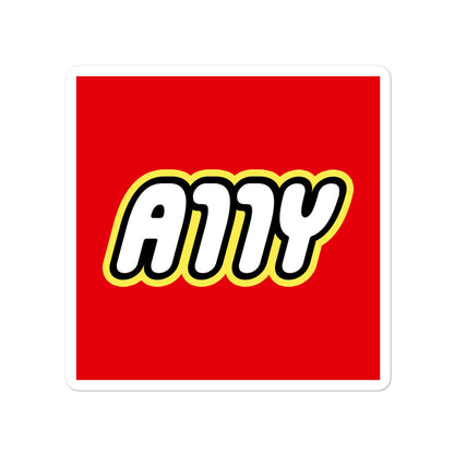 Rounded white A11Y letters surrounded by a black border, surrounded by a yellow border, center aligned on red 4 inch square sticker.