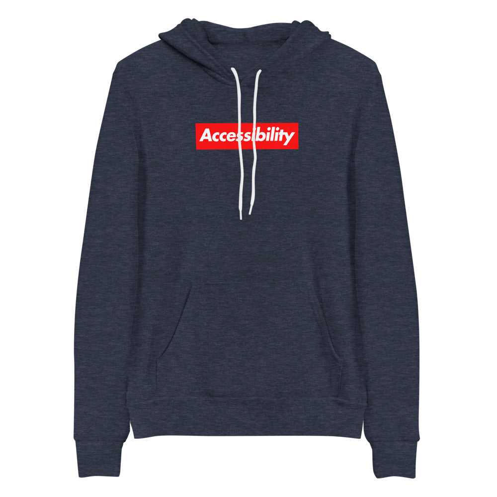White, bold, slightly italic Accessibility word on red background, on heather navy blue hooded sweater.