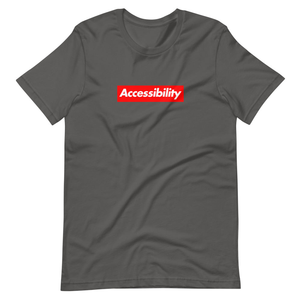 White, bold, slightly italic Accessibility word on red background, on dark grey t-shirt.
