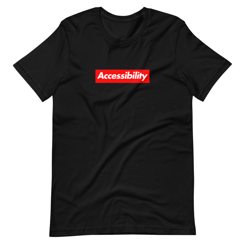 White, bold, slightly italic Accessibility word on red background, on black t-shirt.
