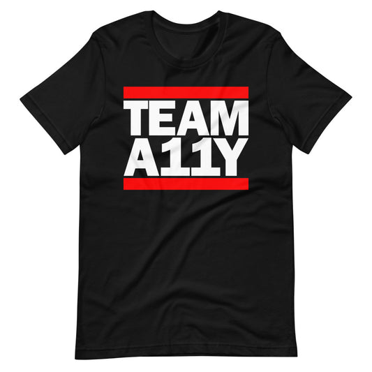White TEAM A11Y text, red bar above and below, center aligned, on front of black t-shirt.