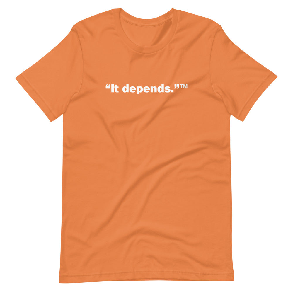 White It depends™ words, center aligned, on front of orange t-shirt.