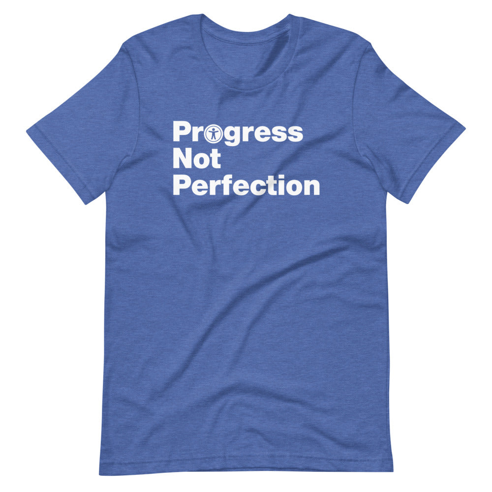 White, Progress Not Perfection, words, stacked, left aligned. 'O' in Progress is round universal icon, on front of heather royal blue t-shirt.