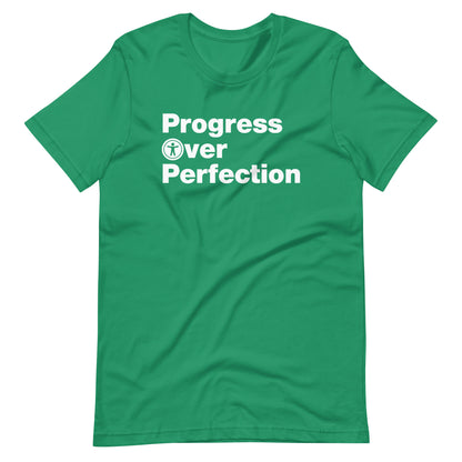 White, Progress Over Perfection, words, stacked, left aligned. 'O' in Over is round universal icon, on front of kelly green t-shirt.