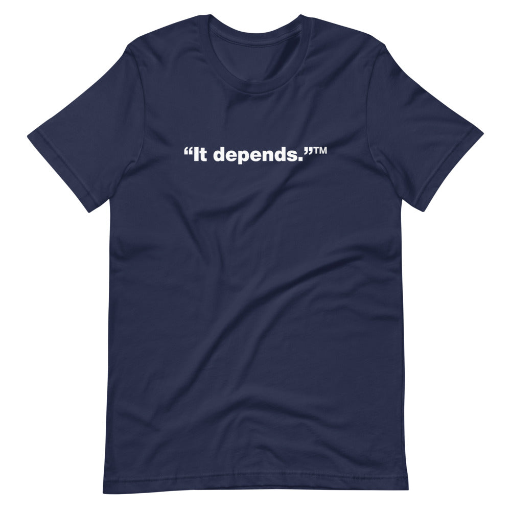White It depends™ words, center aligned, on front of navy blue t-shirt.