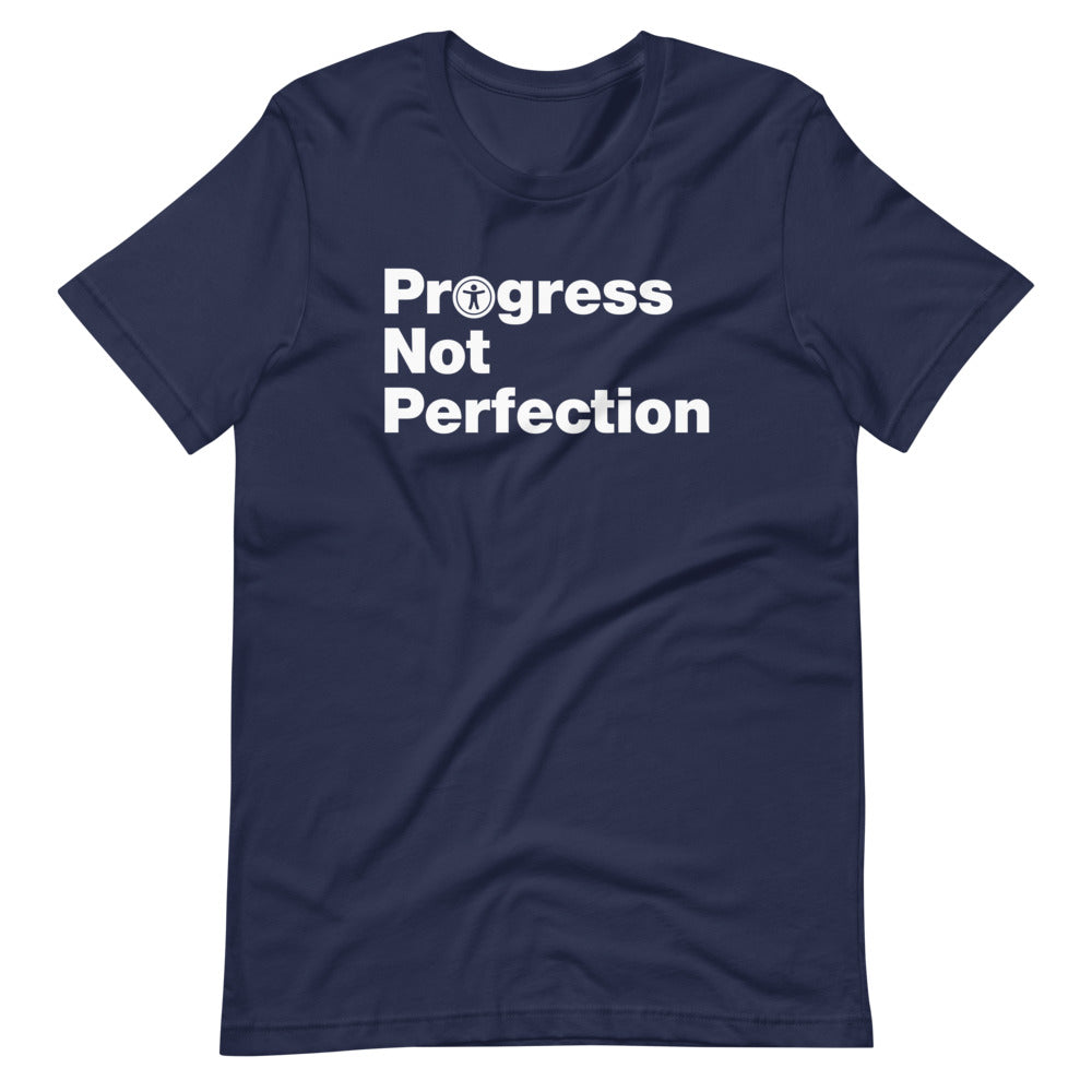 White, Progress Not Perfection, words, stacked, left aligned. 'O' in Progress is round universal icon, on front of navy blue t-shirt.