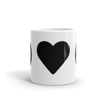 Black heart icon on center of white coffee mug.